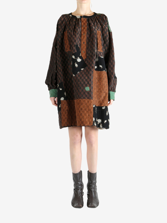 Brown tops worn by a person, showing the top fit