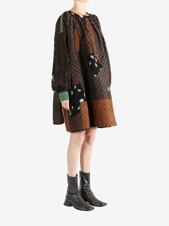 Brown tops worn by a person, showing the top fit