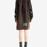 Brown tops worn by a person, showing the top fit