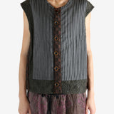 Grey vest worn by a person, showing the vest's fit