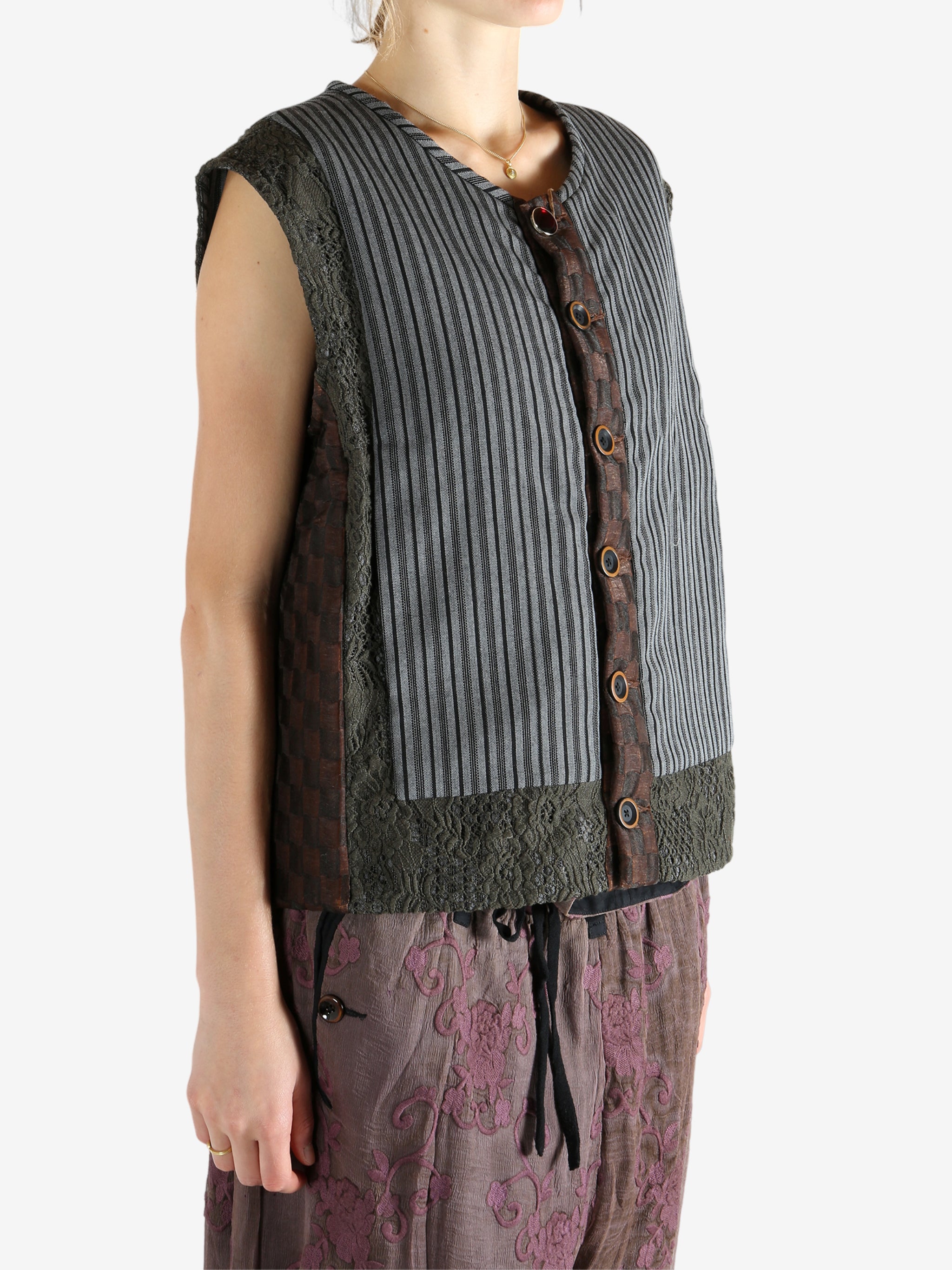 Grey vest worn by a person, showing the vest's fit