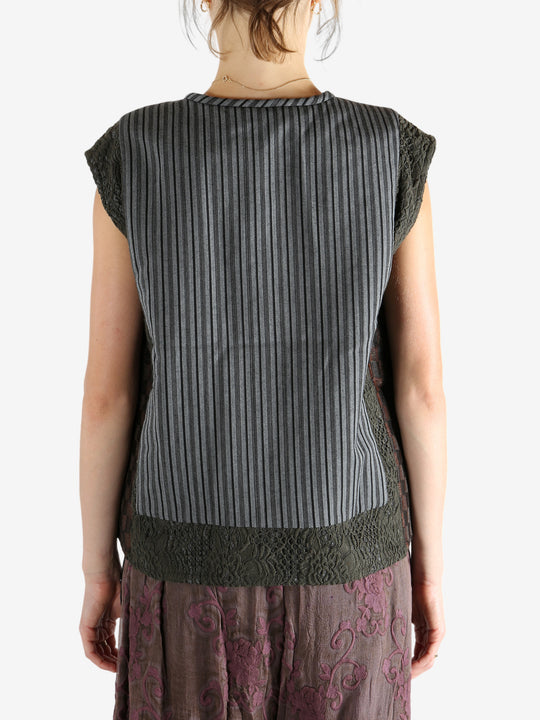 Grey vest worn by a person, showing the vest's fit