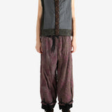 Grey vest worn by a person, showing the vest's fit