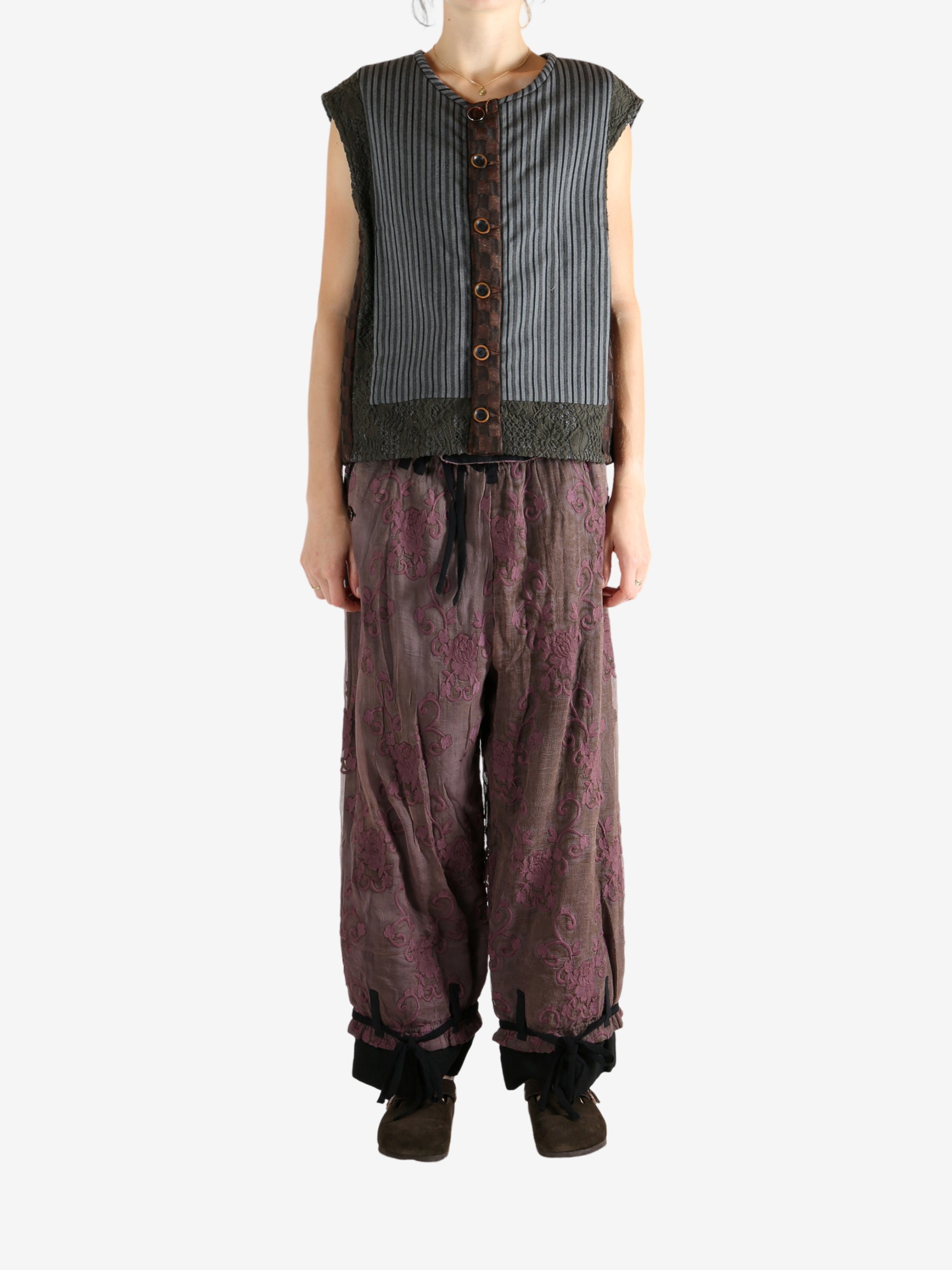 Grey vest worn by a person, showing the vest's fit