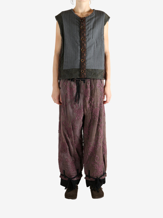 Grey vest worn by a person, showing the vest's fit