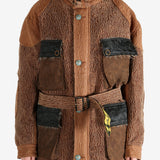 Brown jacket worn by a person, showing the jacket fit