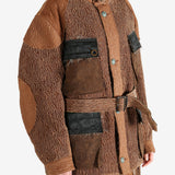 Brown jacket worn by a person, showing the jacket fit