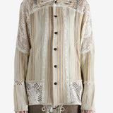 Tan shirt worn by a person, showing the shirt's fit