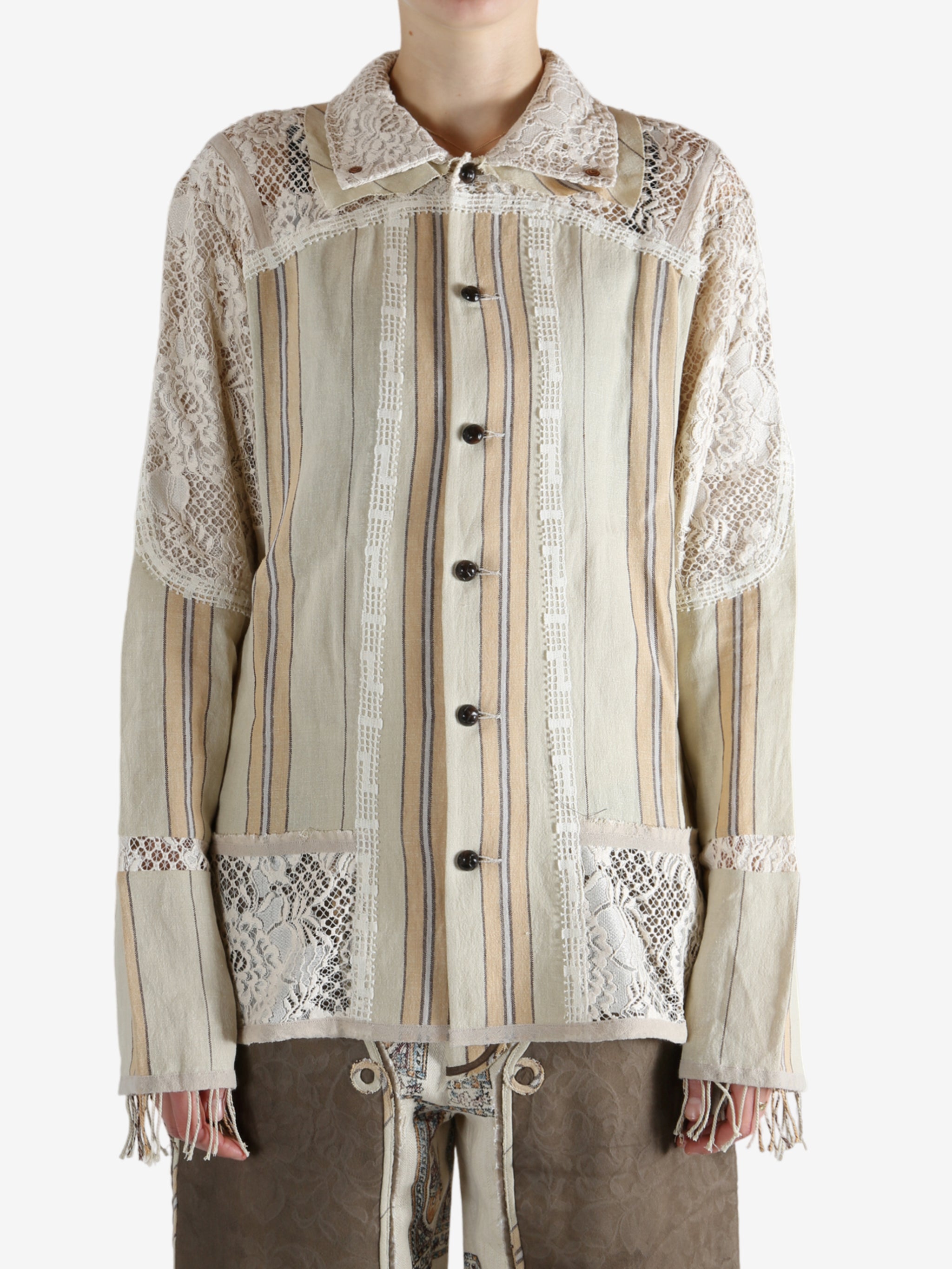 Tan shirt worn by a person, showing the shirt's fit