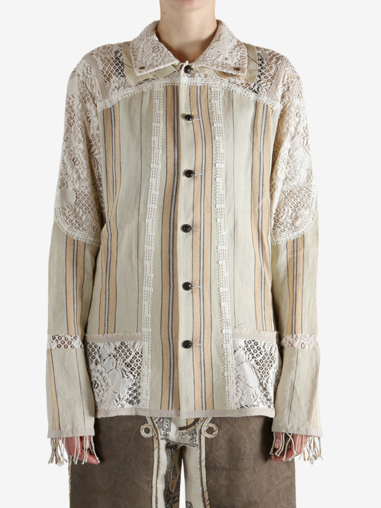 Tan shirt worn by a person, showing the shirt's fit