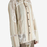 Tan shirt worn by a person, showing the shirt's fit