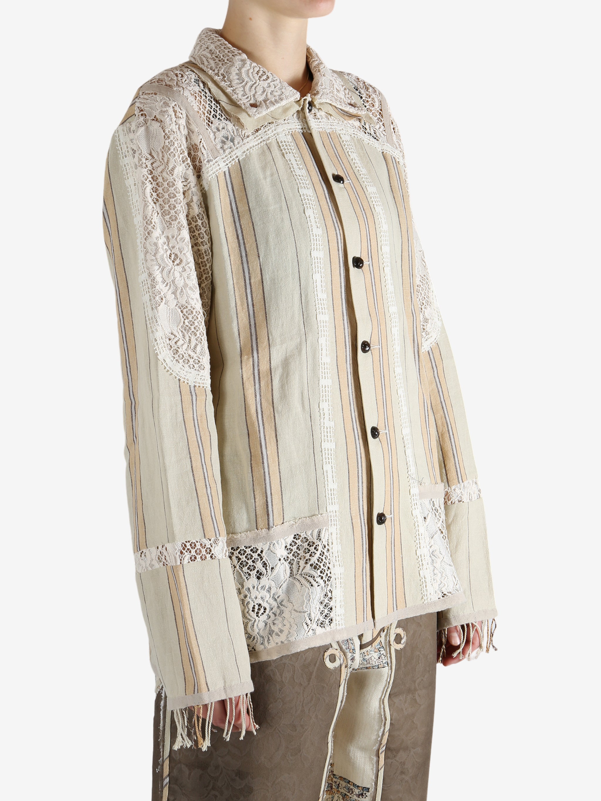 Tan shirt worn by a person, showing the shirt's fit