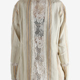 Tan shirt worn by a person, showing the shirt's fit