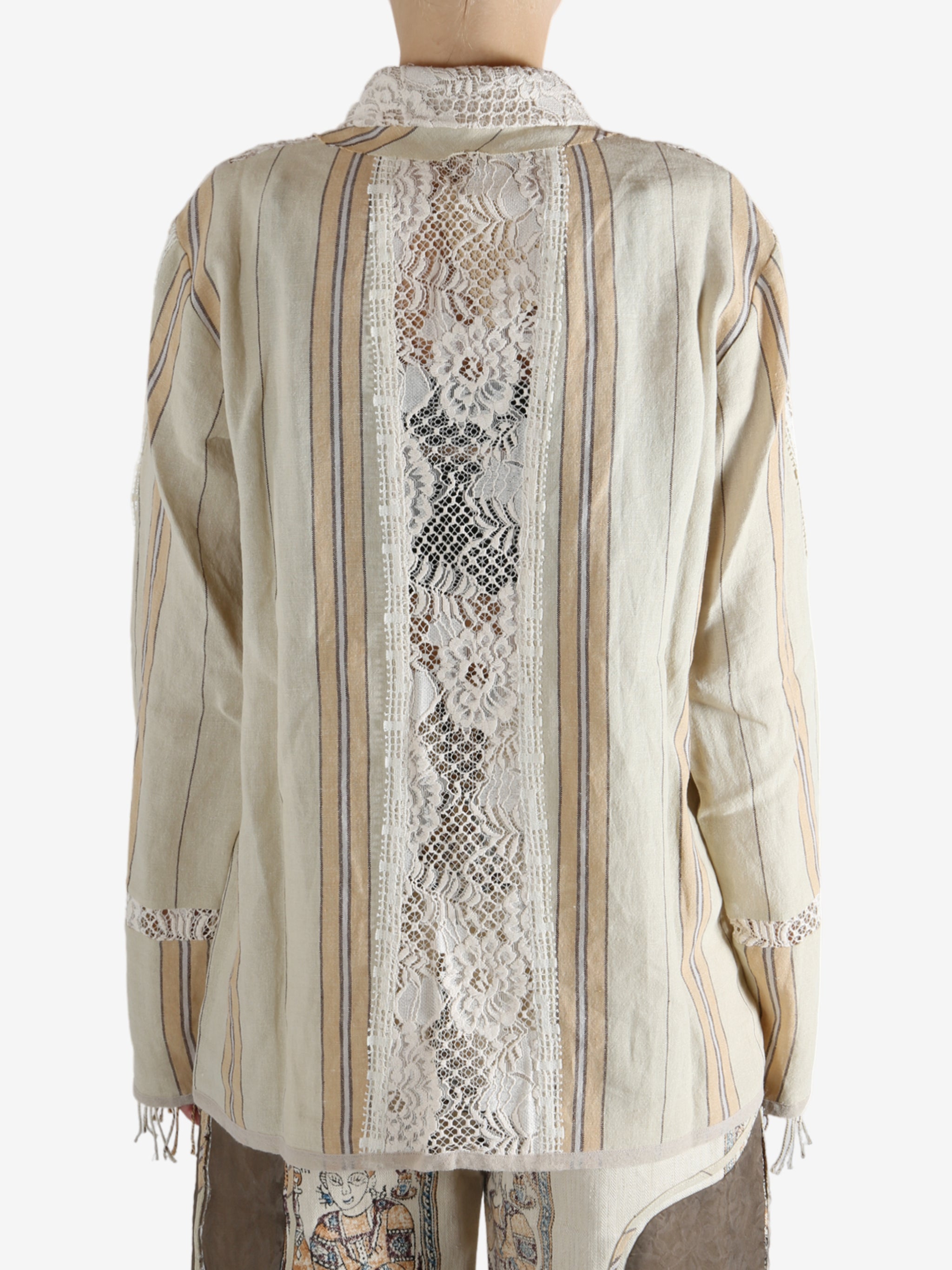 Tan shirt worn by a person, showing the shirt's fit