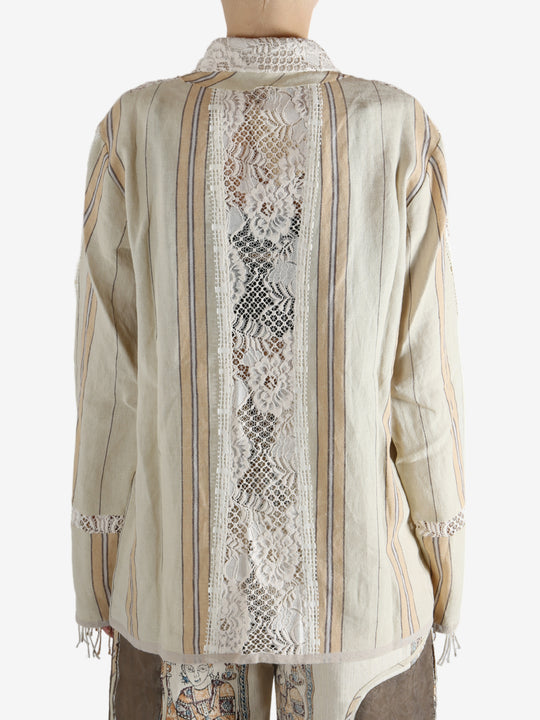 Tan shirt worn by a person, showing the shirt's fit