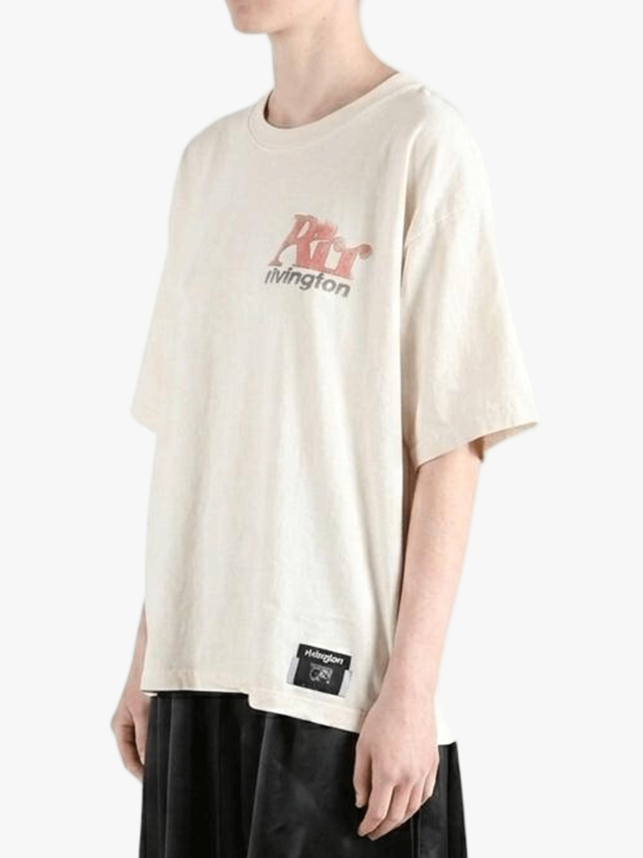 White t-shirt worn by a person, side view