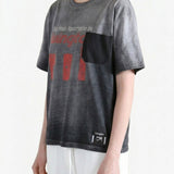 Grey t-shirt worn by a person, showing the t-shirt fit