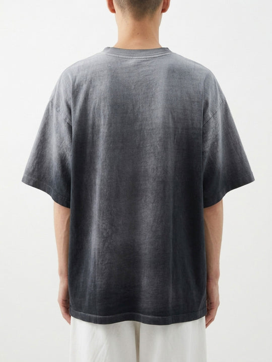 Grey t-shirt worn by a person, showing the t-shirt fit