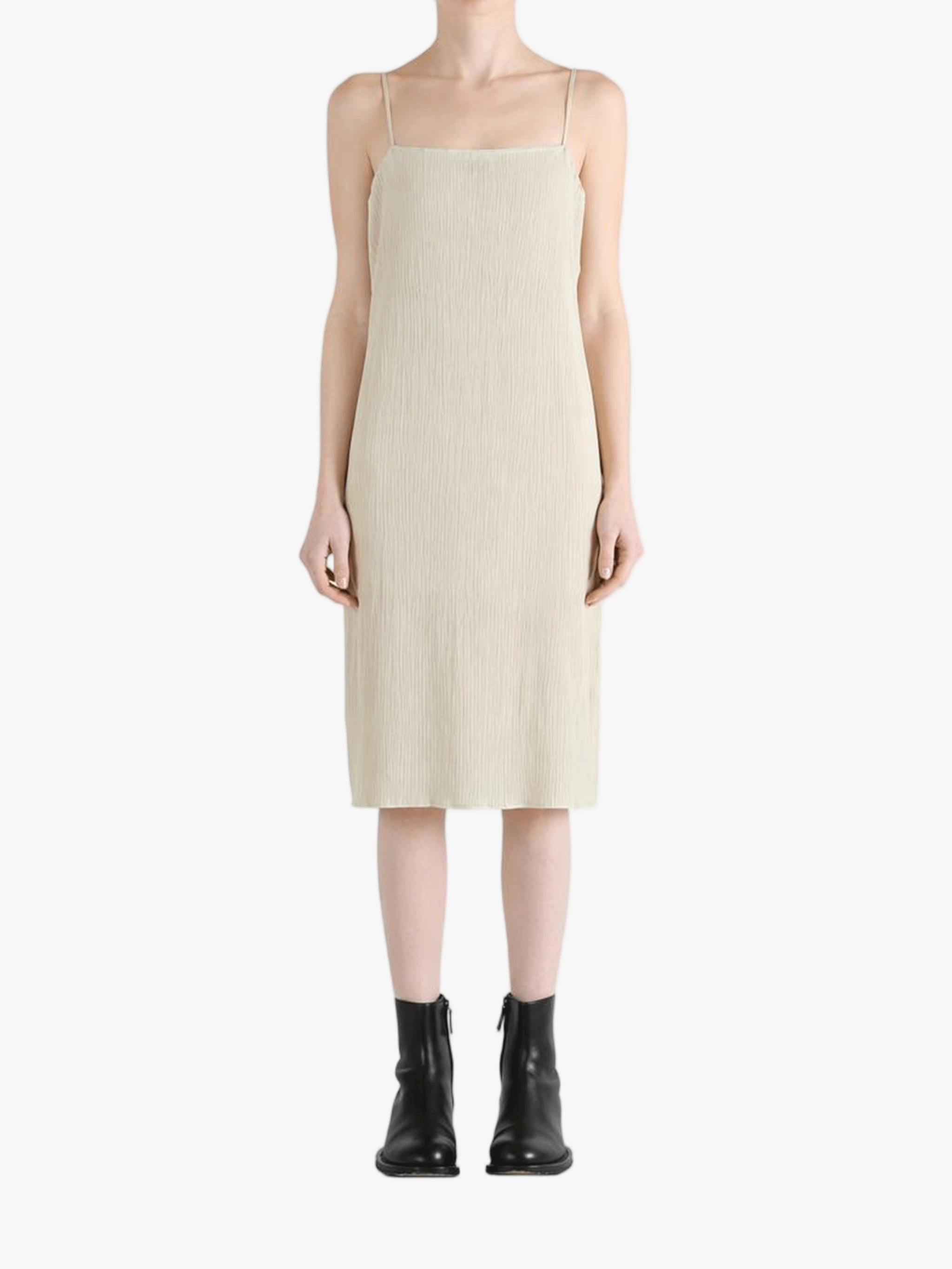 Tan dresses worn by a person, showing the dresses' fit 