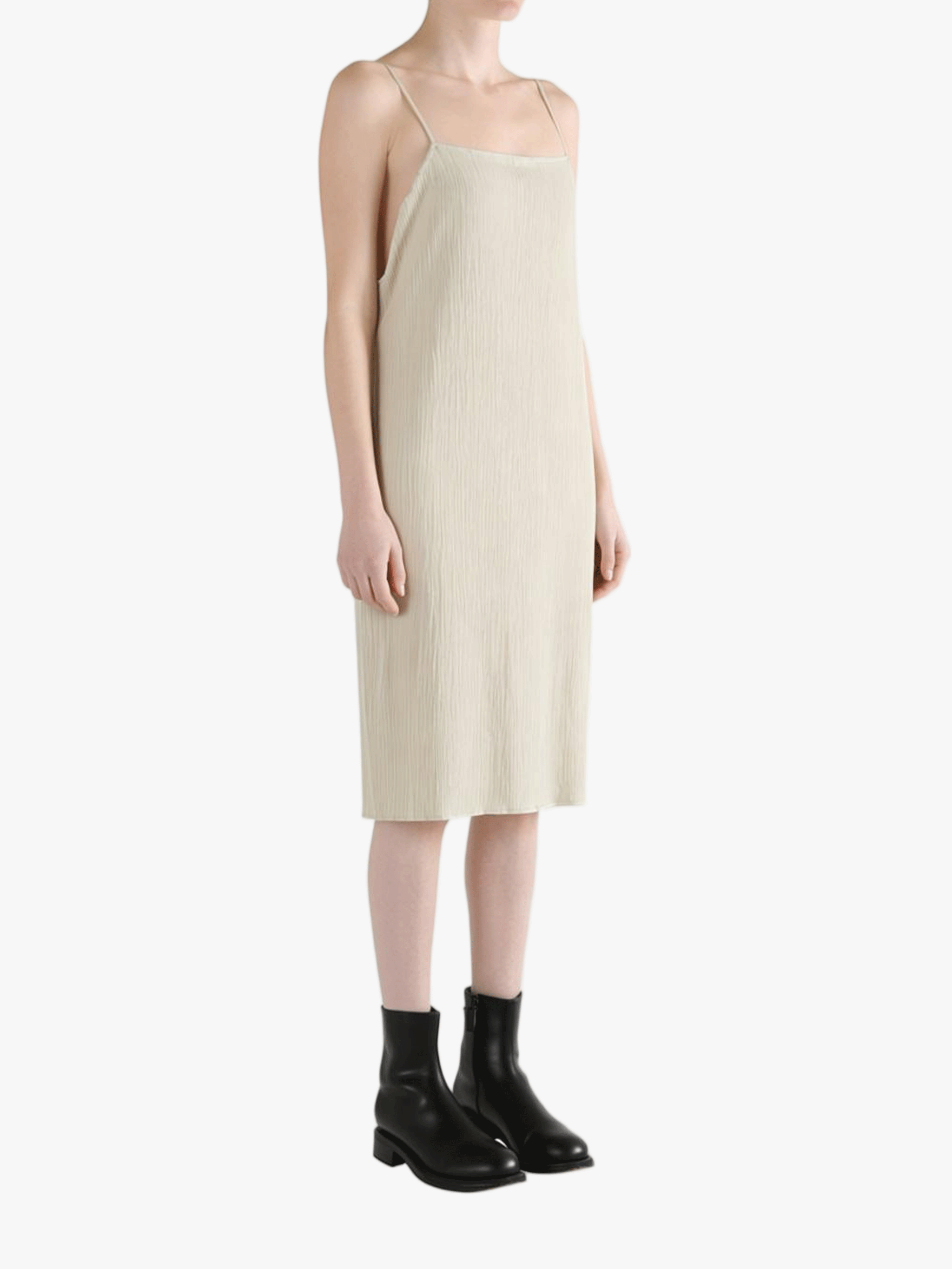 Tan dresses worn by a person, showing the dresses' fit 