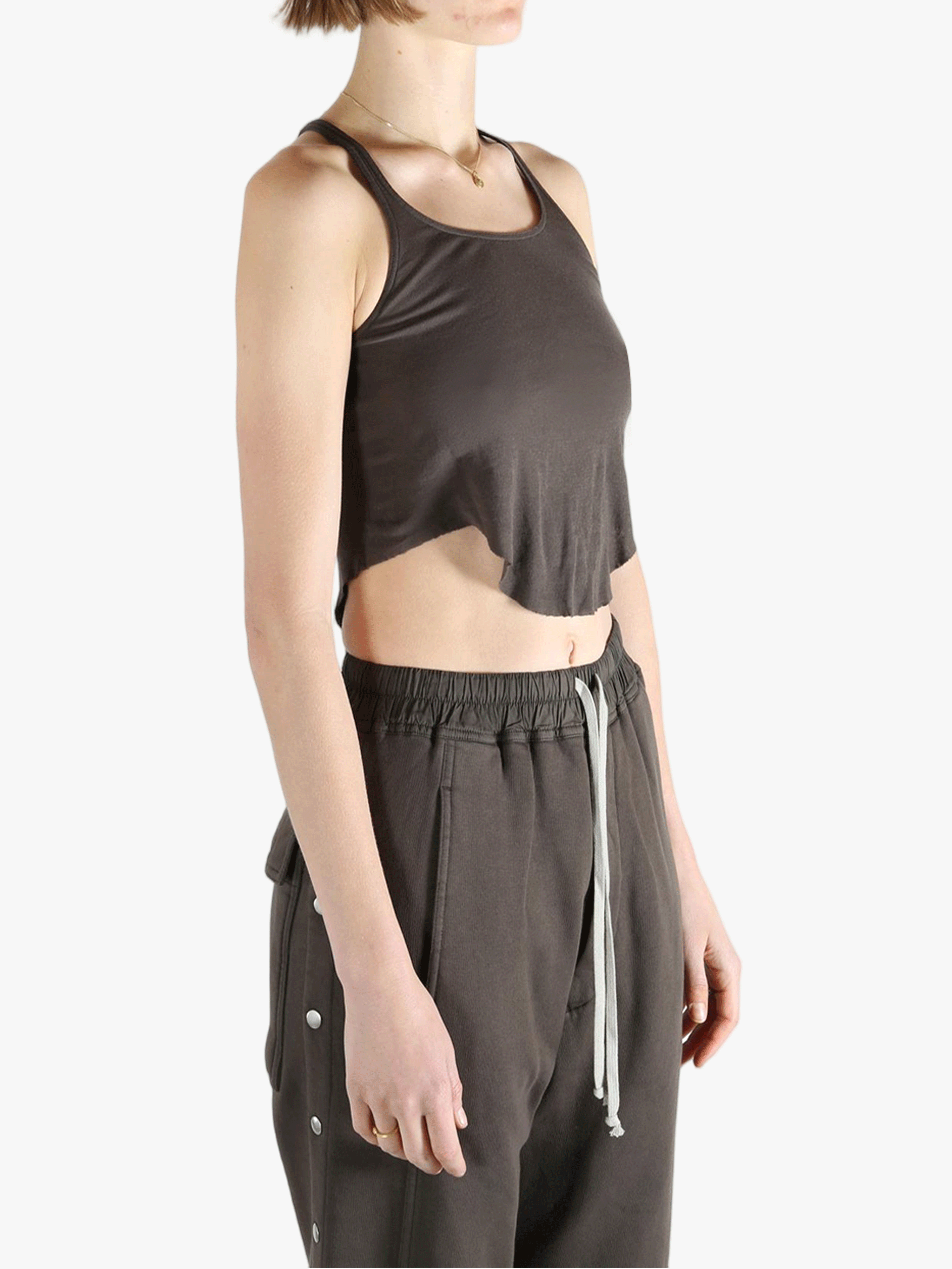 Brown top worn by a person, showing the top's fit