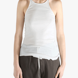 White top worn by a person, showing the top's fit