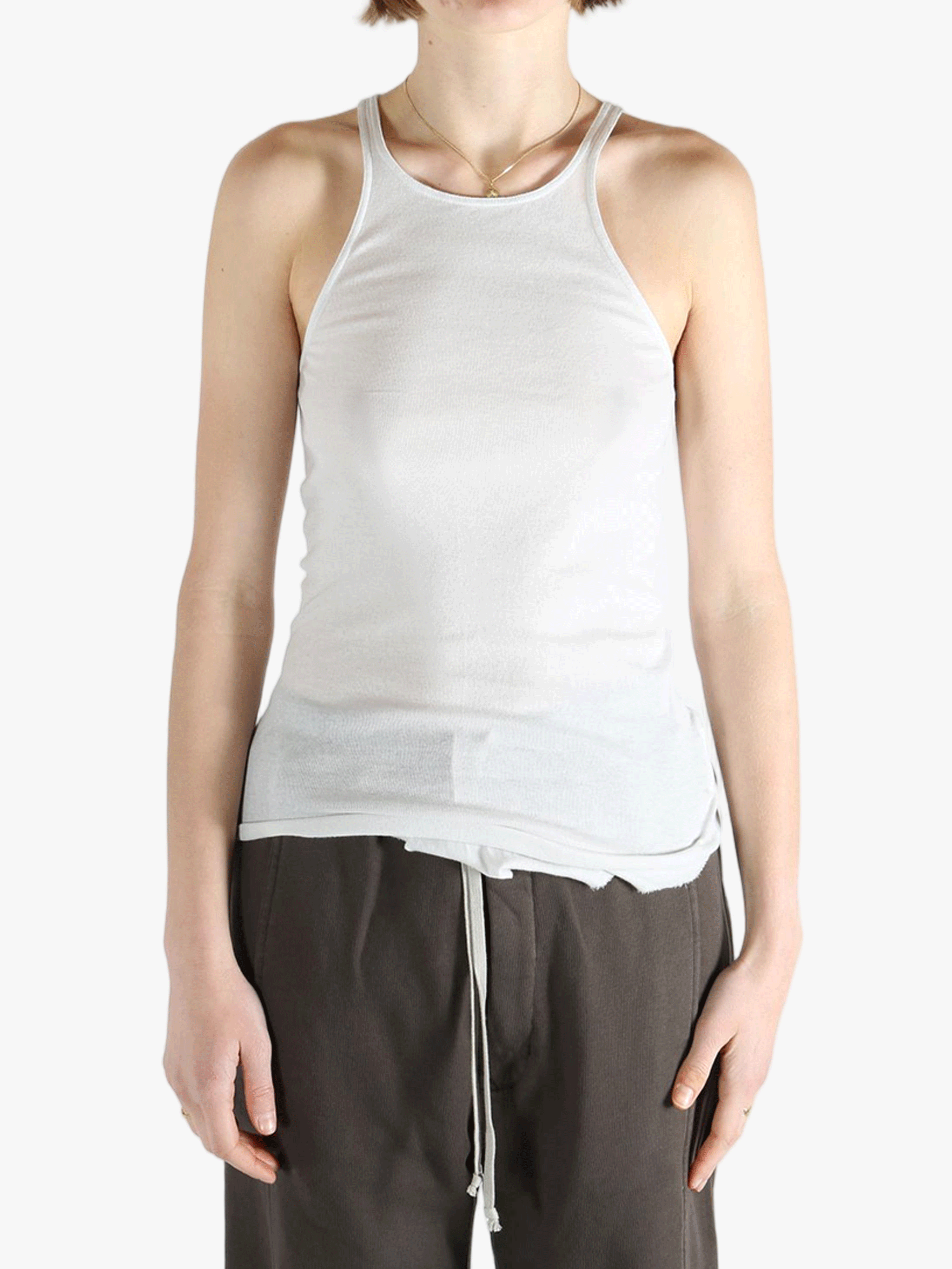 White top worn by a person, showing the top's fit