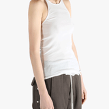 White top worn by a person, showing the top's fit