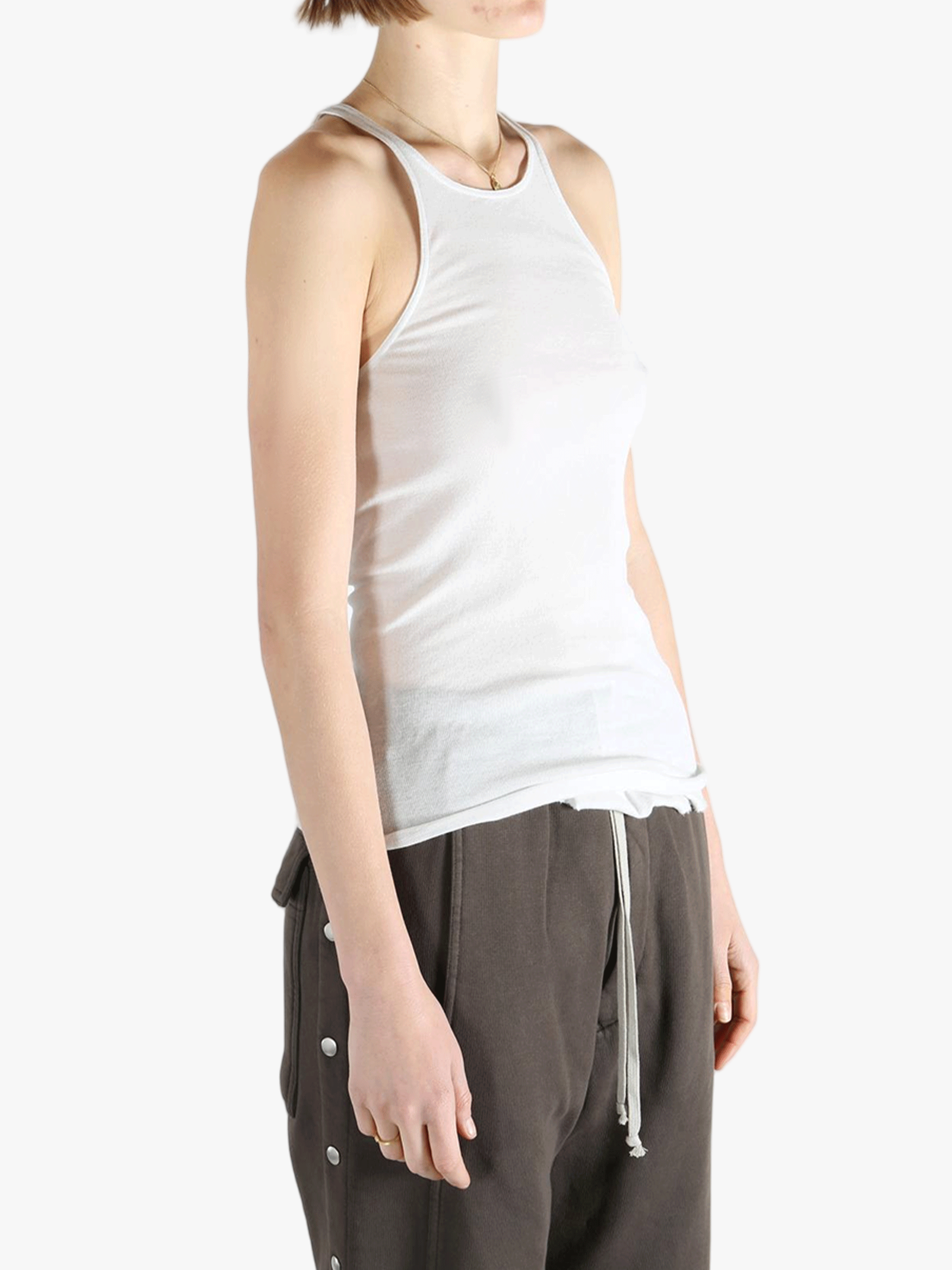 White top worn by a person, showing the top's fit