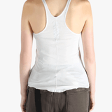 White top worn by a person, showing the top's fit