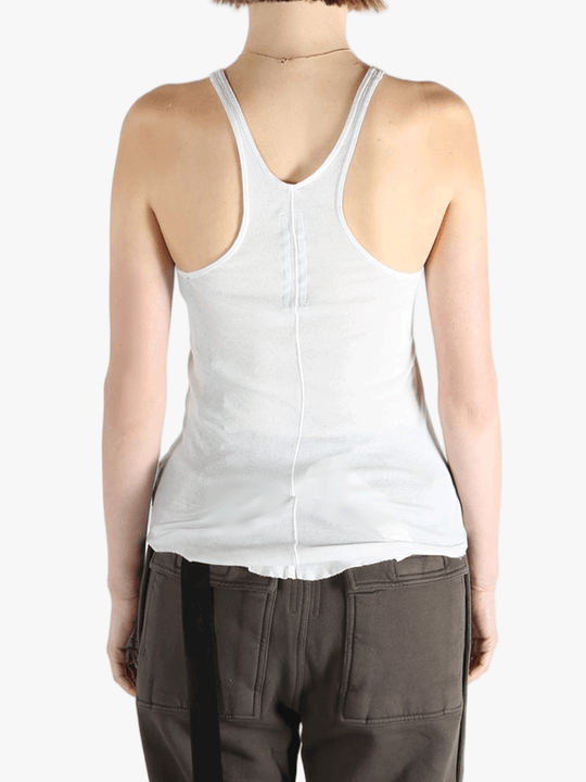 White top worn by a person, showing the top's fit