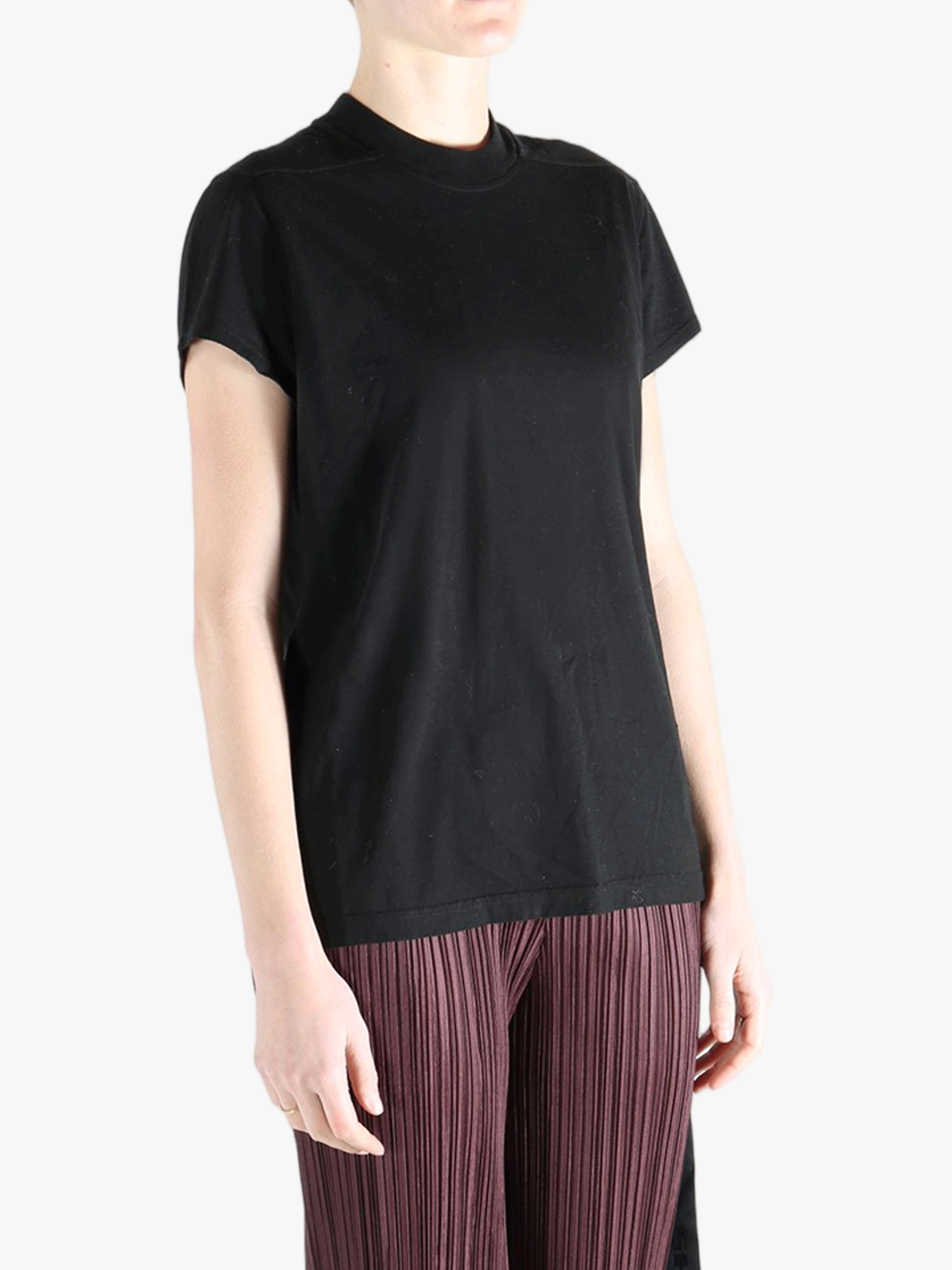 Black shirt worn by a person, showing the shirt's fit