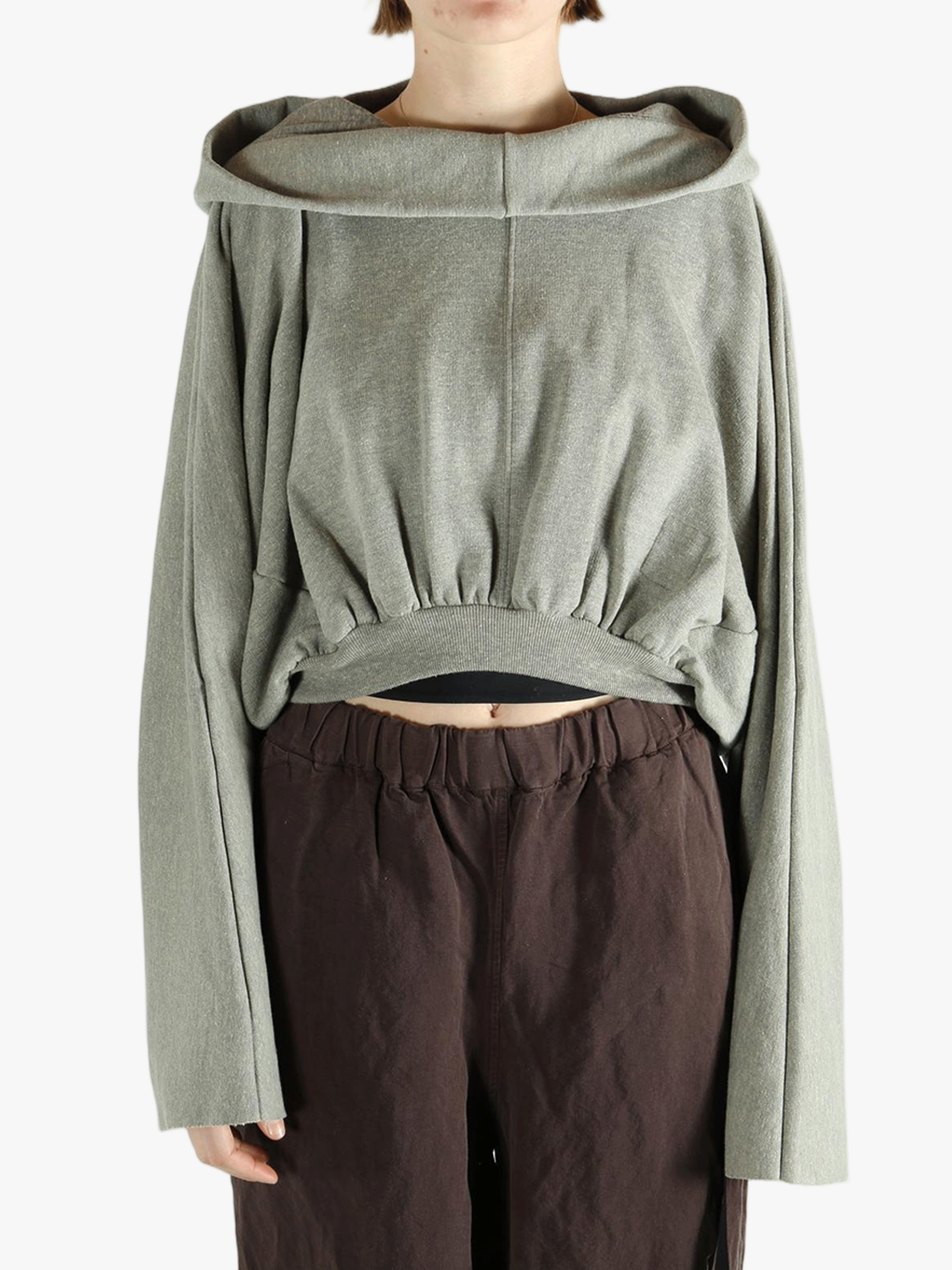 Grey top worn by a person, showing the top's fit