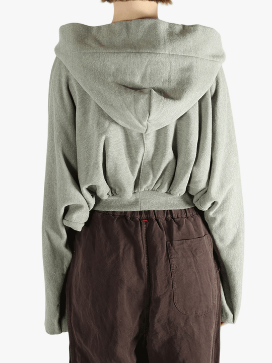 Grey top worn by a person, showing the top's fit