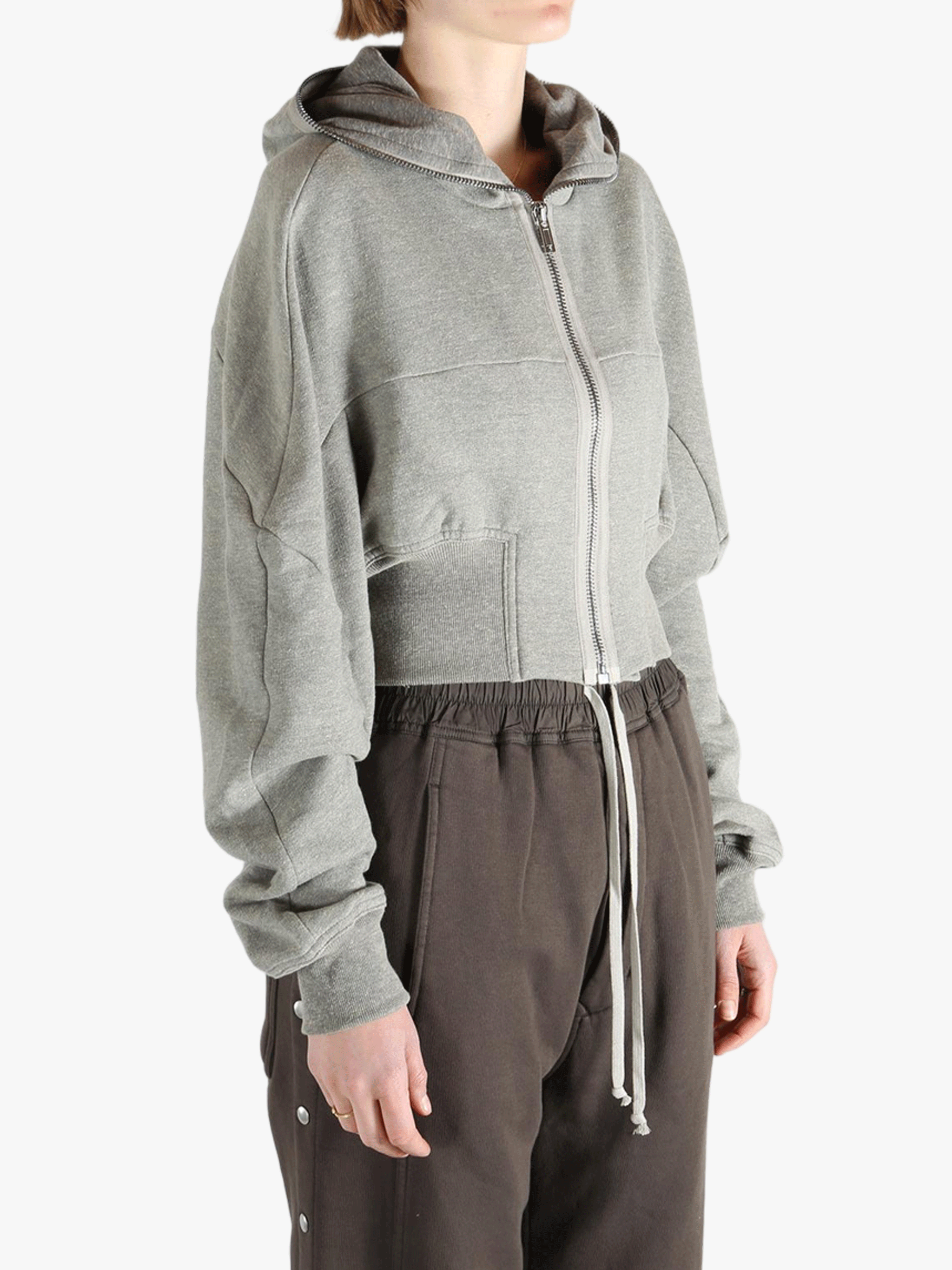Grey hoodie worn by a person, showing the hoodie's fit