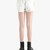 White shorts worn by a person, showing the shorts's fit