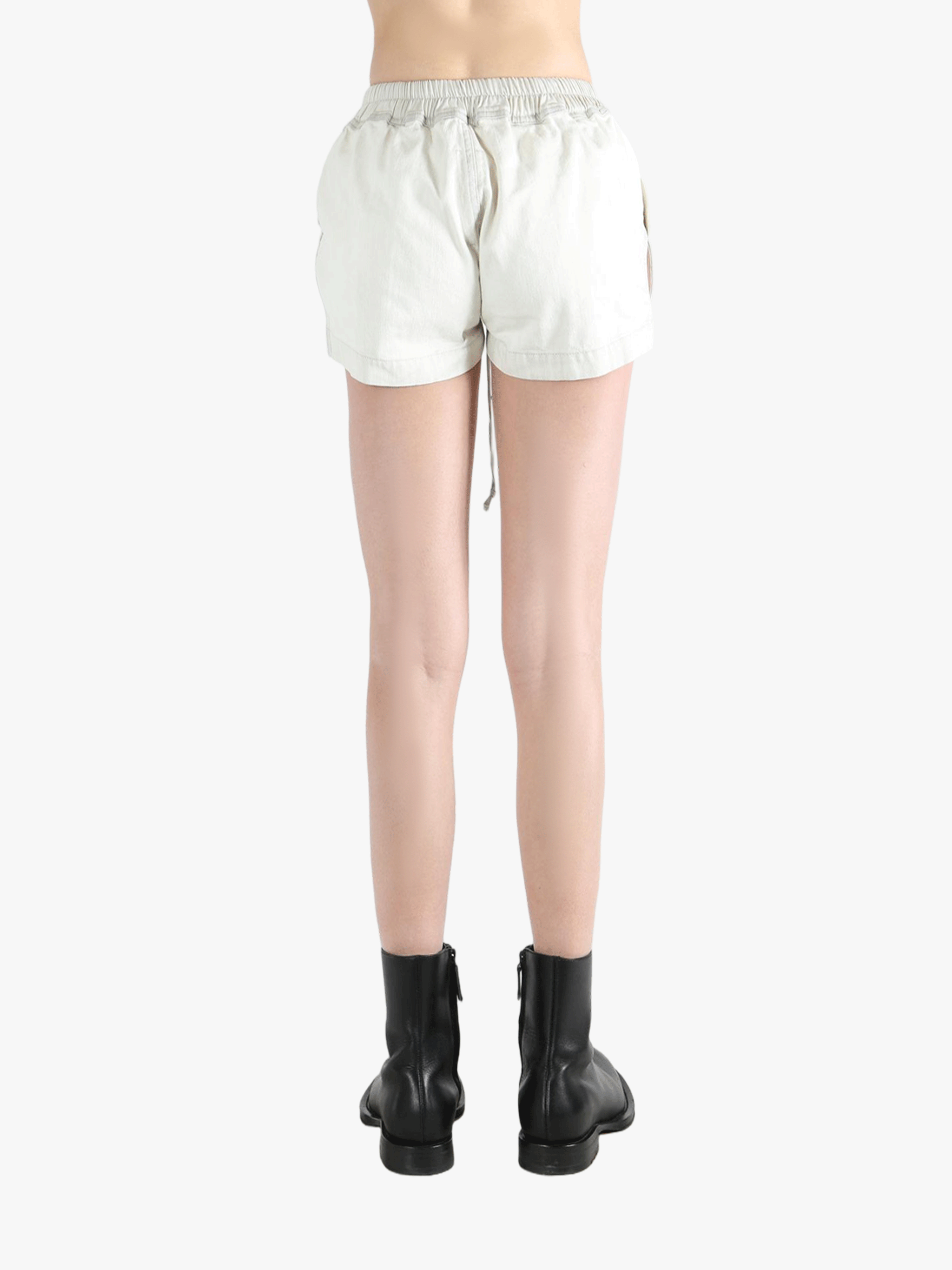 White shorts worn by a person, showing the shorts's fit