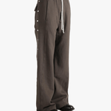 Brown pants worn by a person, showing the pants's fit