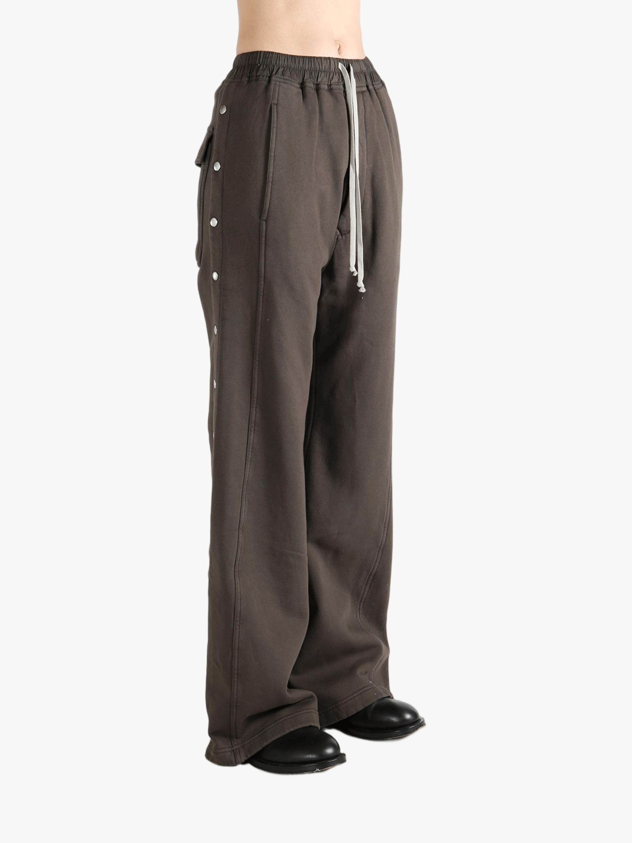 Brown pants worn by a person, showing the pants's fit