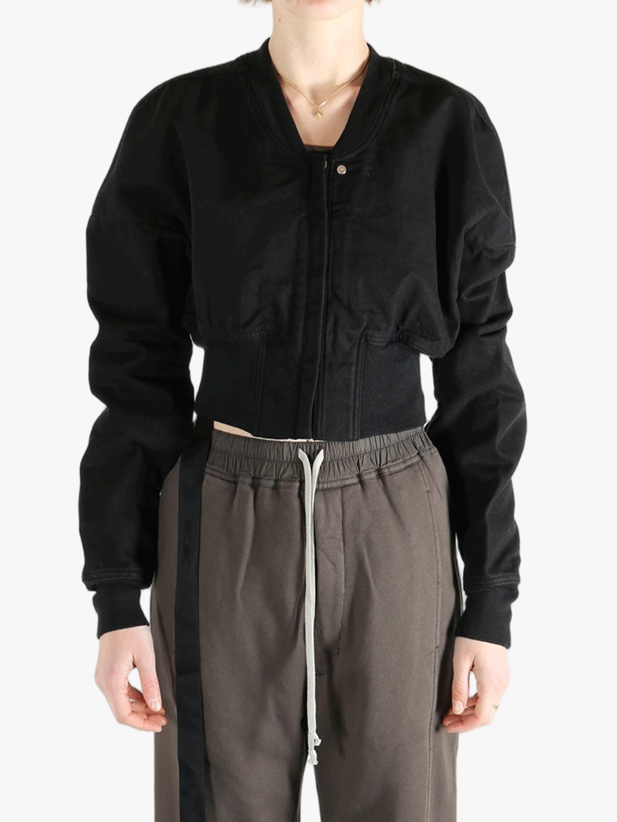 Black jacket worn by a person, showing the jacket's fit