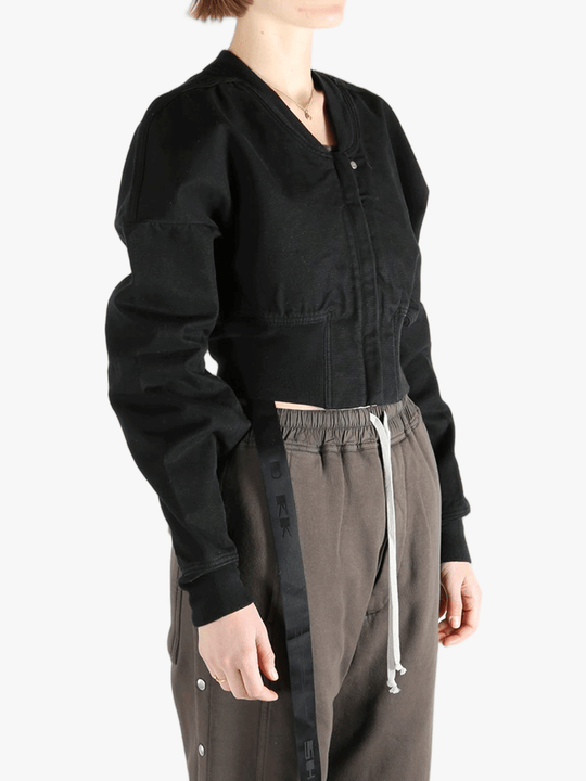 Black jacket worn by a person, showing the jacket's fit