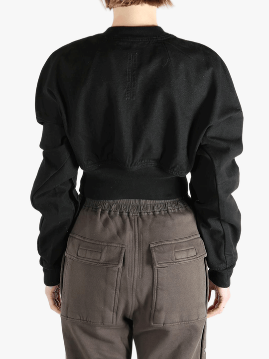 Black jacket worn by a person, showing the jacket's fit