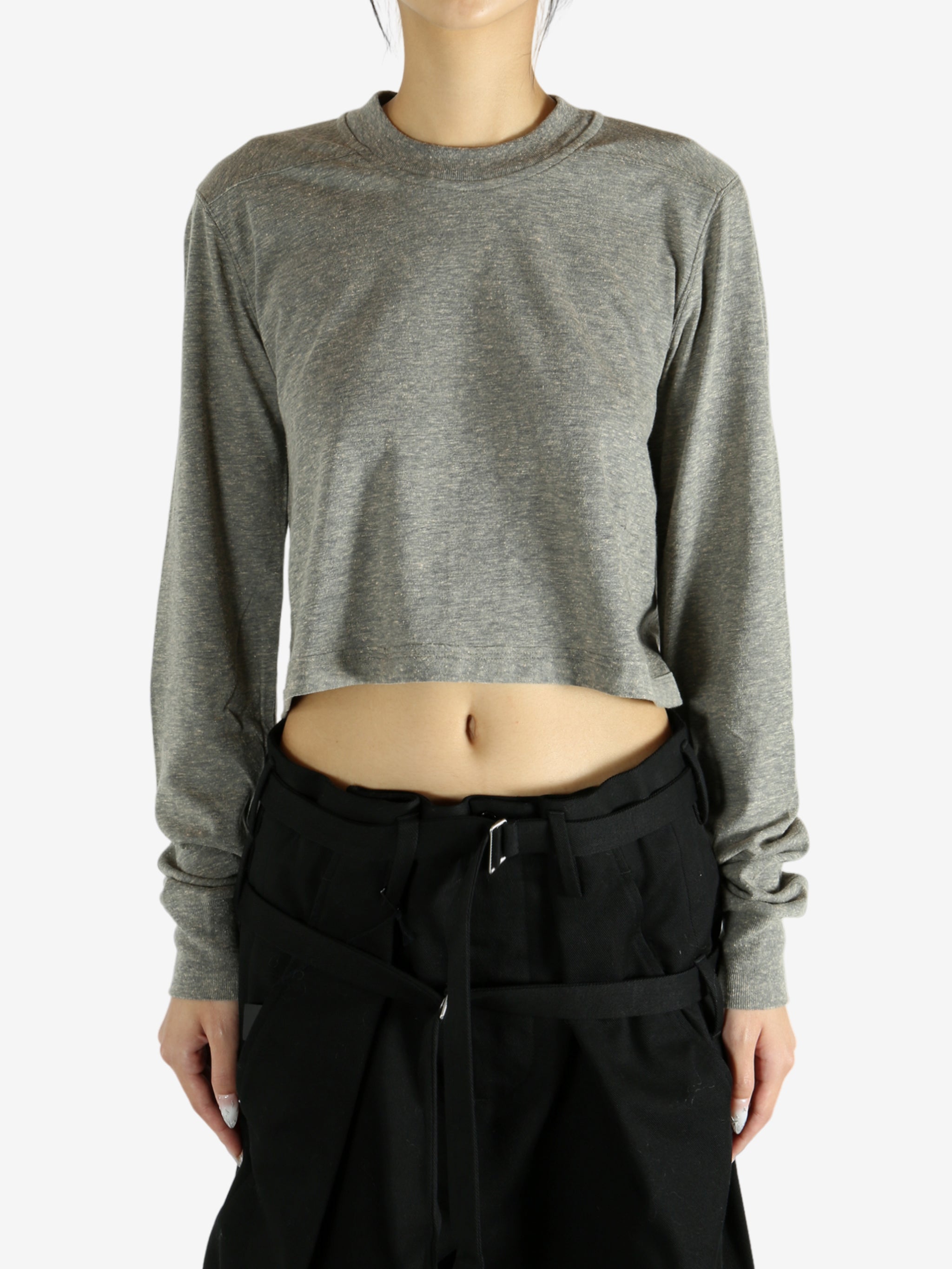 Grey t-shirt worn by a person, showing the shirt's fit