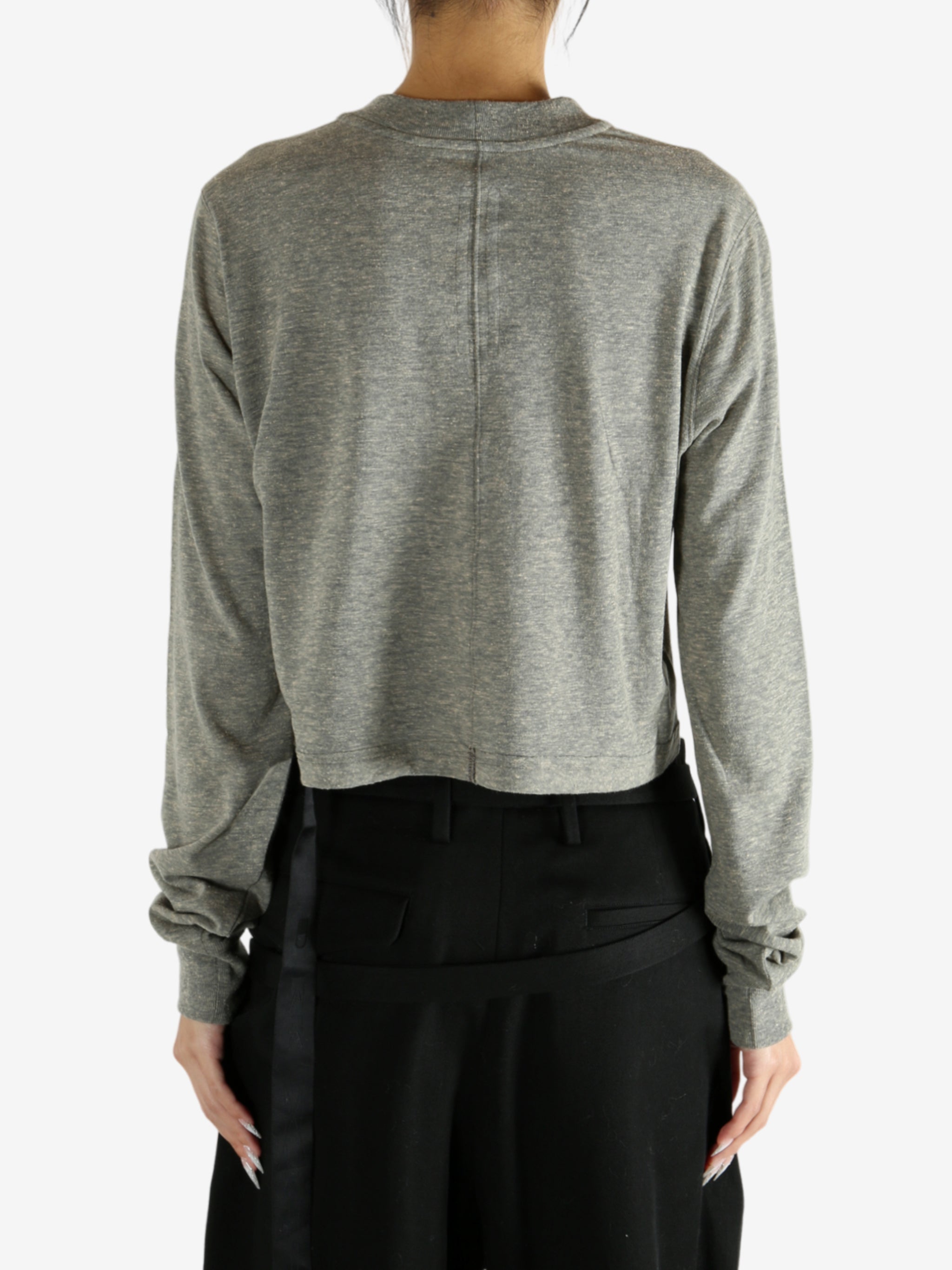 Grey t-shirt worn by a person, showing the shirt's fit