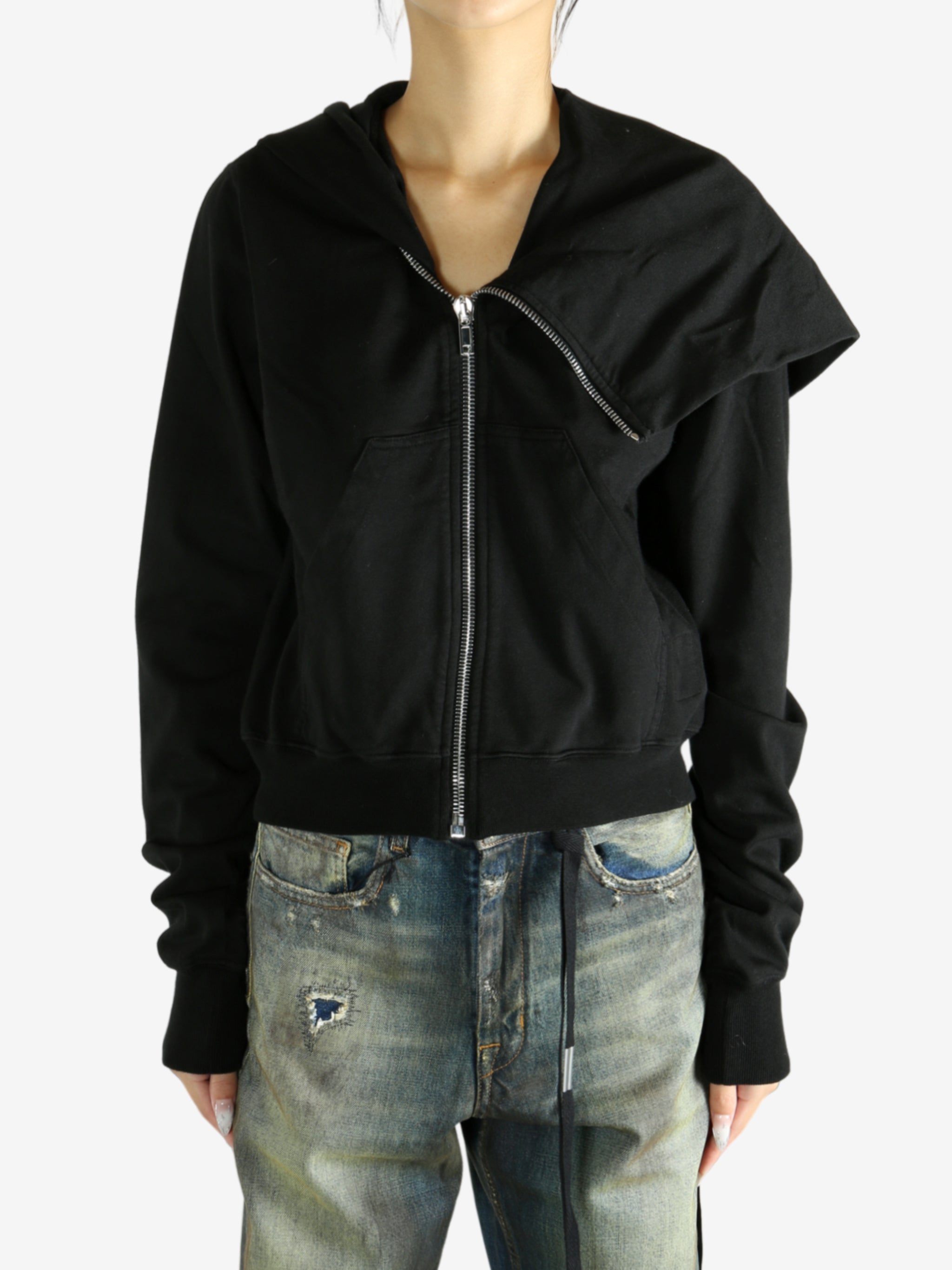 black jacket worn by a person, showing the jacket fit