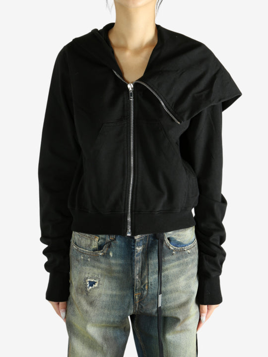 black jacket worn by a person, showing the jacket fit