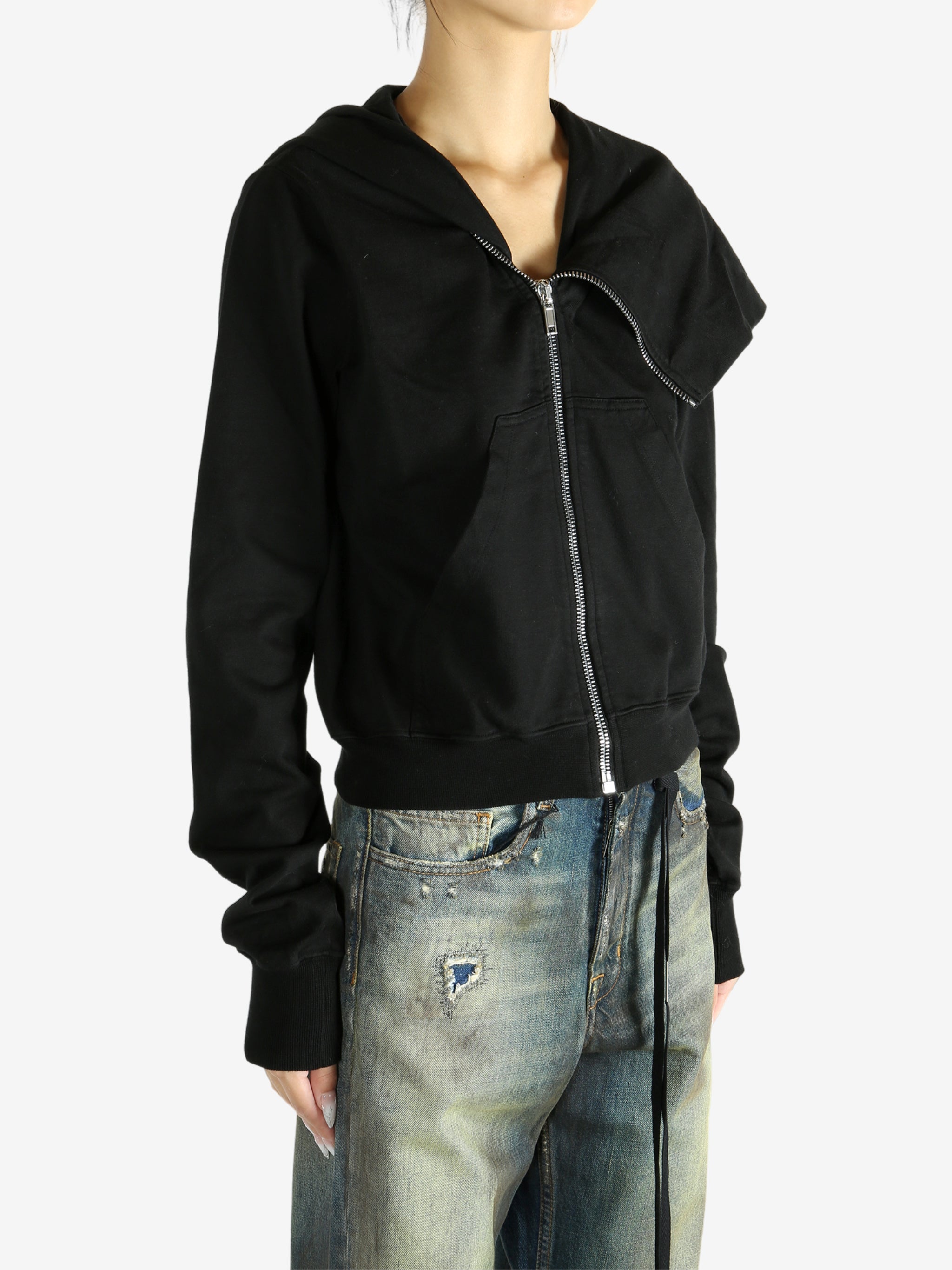 black jacket worn by a person, showing the jacket fit