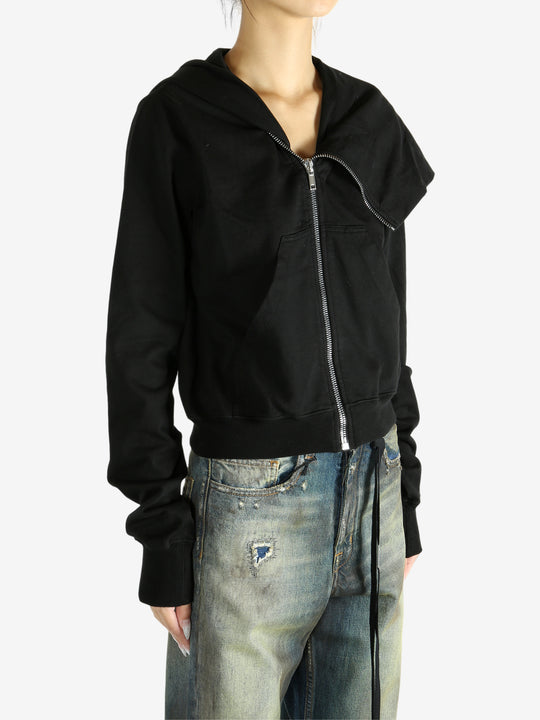 black jacket worn by a person, showing the jacket fit