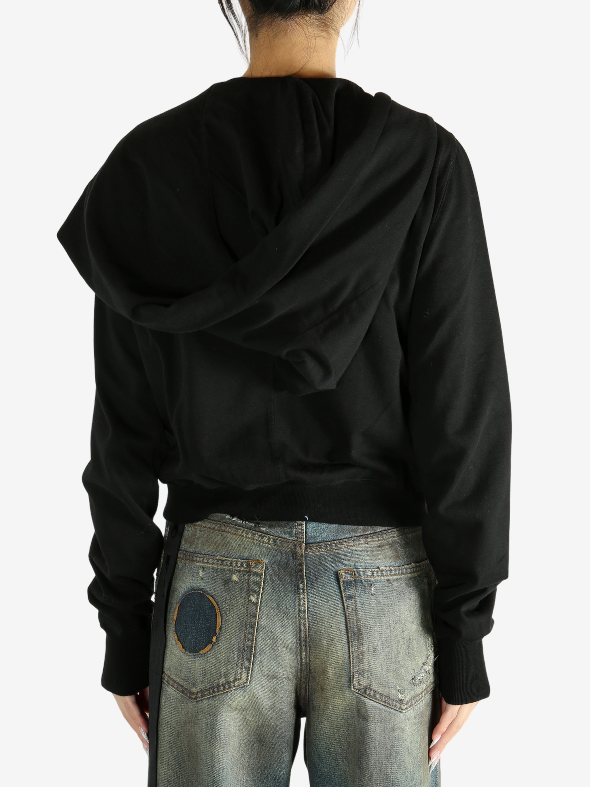 black jacket worn by a person, showing the jacket fit