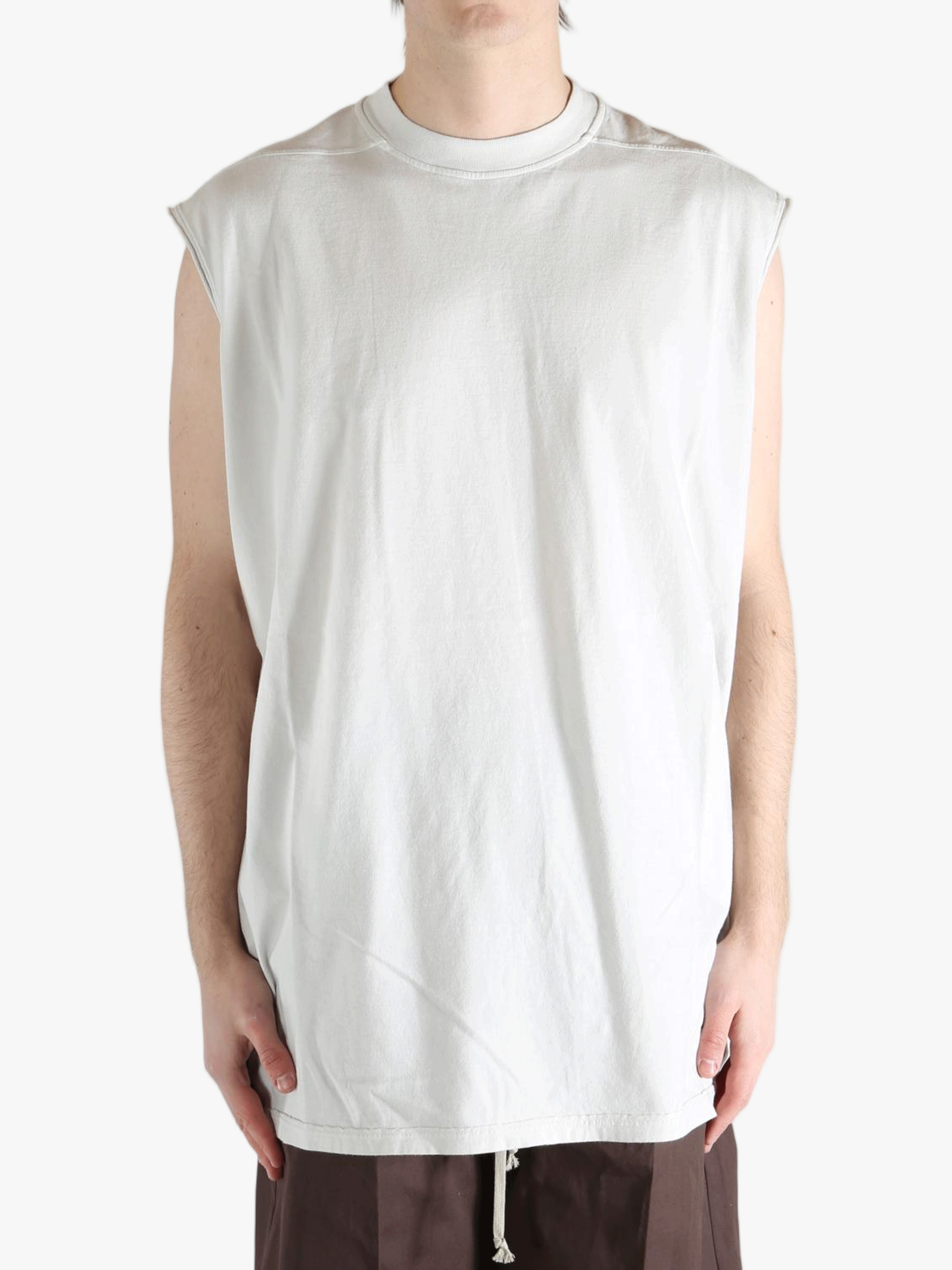 White shirt worn by a person, showing the shirt's fit